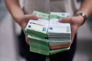 depositphotos_380466730-stock-photo-bank-employees-holding-pile-paper.jpg  